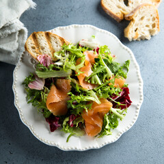 Healthy green salad with smoked salmon
