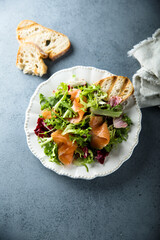 Healthy green salad with smoked salmon