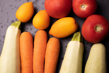 vegetables on black stone surface