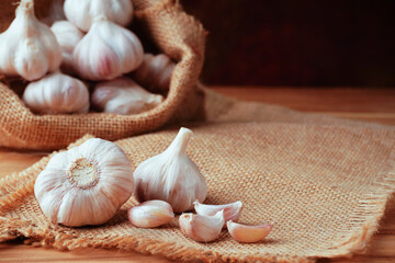 Garlic Cloves and Bulb on the wooden table.Healthy food concept.