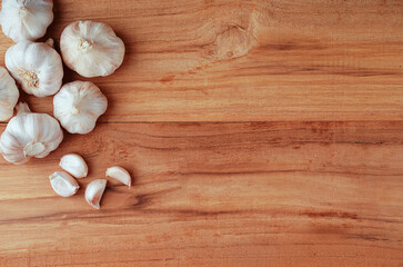 Garlic Cloves and Bulb on the wooden table.Healthy food concept.