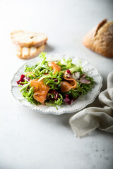 Healthy green salad with smoked salmon