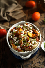 Homemade pasta bake with tomato sauce and cheese