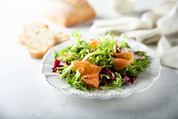 Healthy green salad with smoked salmon