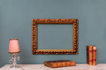 Empty gold rectangular vintage frame on a wall