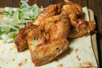 Fried chicken on wooden board