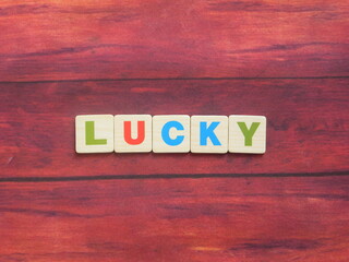 Word Lucky on wood background