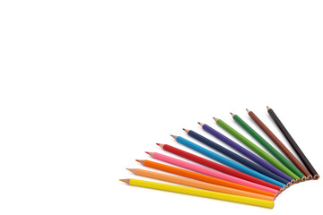 Multi-colored pencils isolated on a white background. Banner on the site, copy space.
