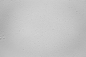 Water or rain drops on white plastic sheet background 