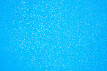 Water or rain drops on blue background 