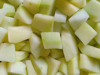 Diced cut white color raw unripe Papaya fruit