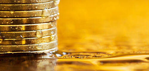 Gold investments concept, precious metal savings, stack of money coins. COVID-19 finance. Web banner.