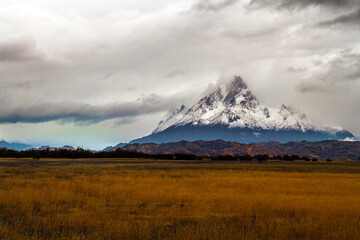 Fototapeta premium Peaked snow-capped mountain peak