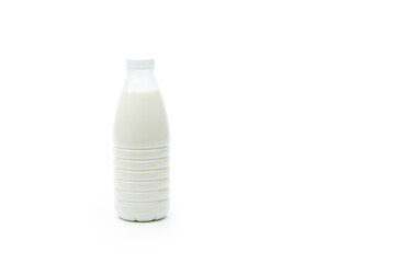 Full plastic bottle of milk isolated on a white background.