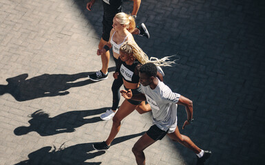 Multi-ethnic group running together