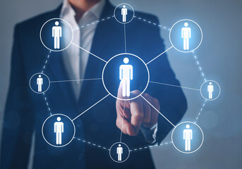 Businessman pointing digital icon  Human resources. CRM and recruitment.
