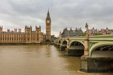 Big Ben by Westminster Bridge and the River Thames on a cloudy day in London