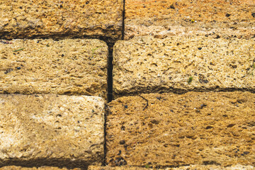 porous sand brick stones, close- up macro photo, selective focus