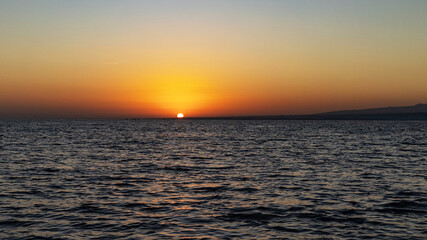 beautiful sunset at the ocean on Bali island