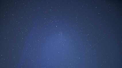 Star with satellite trail - night sky background.