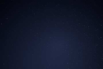 Naklejka na ściany i meble Stars in the night sky. Abstract background.