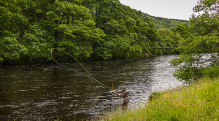 An fisherman salmon fly fishing on the River Orchy, Argyll, Scotland