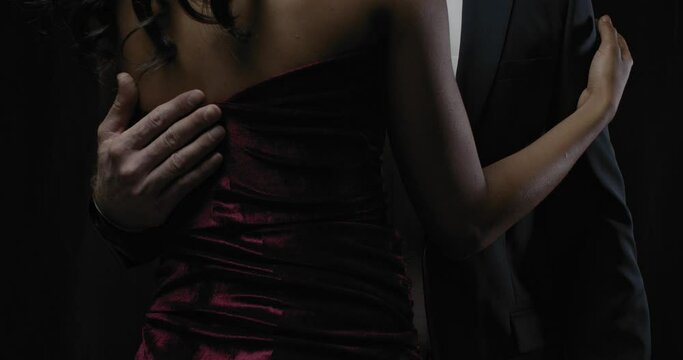 A man is holding a woman in a dress, hug, elegant, close up, 4k