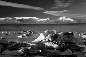 sunset in a glacial lagoon under the iceberg