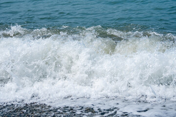 Fototapeta na wymiar Waves on the Black Sea coast in Anaklia, Georgia