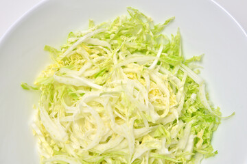 Chinese cabbage salad on white background. Vegan food.