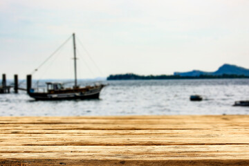 Wooden table at Lake Garda in Italy with a free space for an advertising product