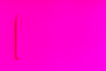 Magenta colored highlighters at magenta background with copy space