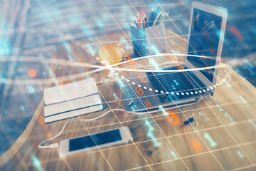 Stock market graph on background with desk and personal computer. Multi exposure. Concept of...