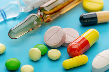  Colored tablets, capsules and injections for treatment. Pharmaceutical industry. Pharmacy.