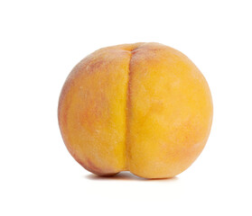 whole ripe yellow peach isolated on a white background