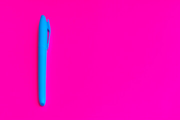 Magenta colored highlighters at magenta background with copy space