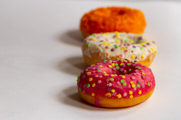 colorful doughnuts with sprinkles isolated