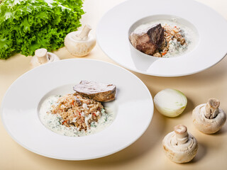 Beef with rice in a creamy mushroom sauce.
