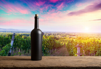 corkscrew and wooden barrel, vineyard on background