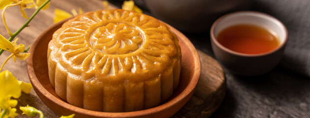Mooncake, Moon cake for Mid-Autumn Festival, concept of traditional festive food on black slate...