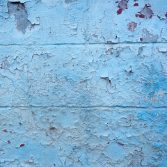 grungy blue painted cracked part of outside wall