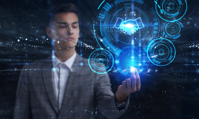 Business, Technology, Internet and network concept. Young businessman working on a virtual screen of the future and sees the inscription: