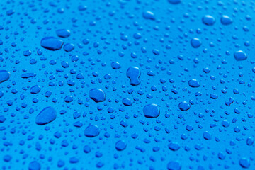 Car Body Covered by Water Drops Close Up