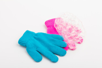 Child  brighte gloves whith soap bubble on white background.