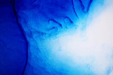 Blue Background. Blue ink texture with abstract washes and paint stains on the white paper background. Hand painted background. Blue ink background for design