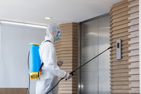 Coronavirus Quarantine.Medical staff wearing protective clothing disinfects the public place, pandemic health risk