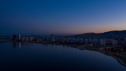 Fototapeta na wymiar Aerial view of seaside city at sunrise. Izmir Turkey. 