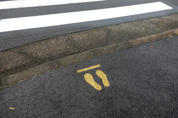 A pedestrian stop sign in front of a pedestrian crossing in Nara, Japan, July 25, 2020.