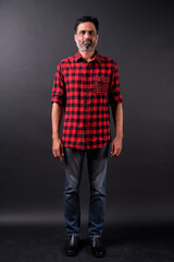 Portrait of mature bearded Indian hipster man