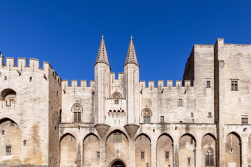 View of the castle facade of Palace of the Popes in the city of Avignon
